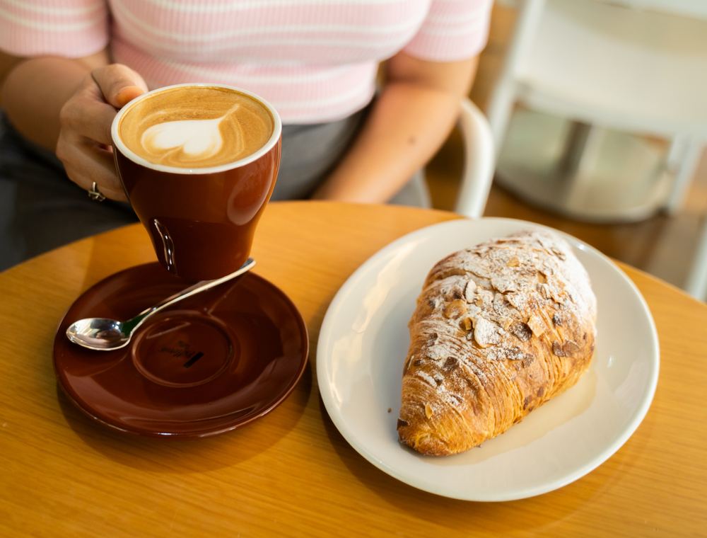 Flat white and almond croissant at Ultra Brasserie